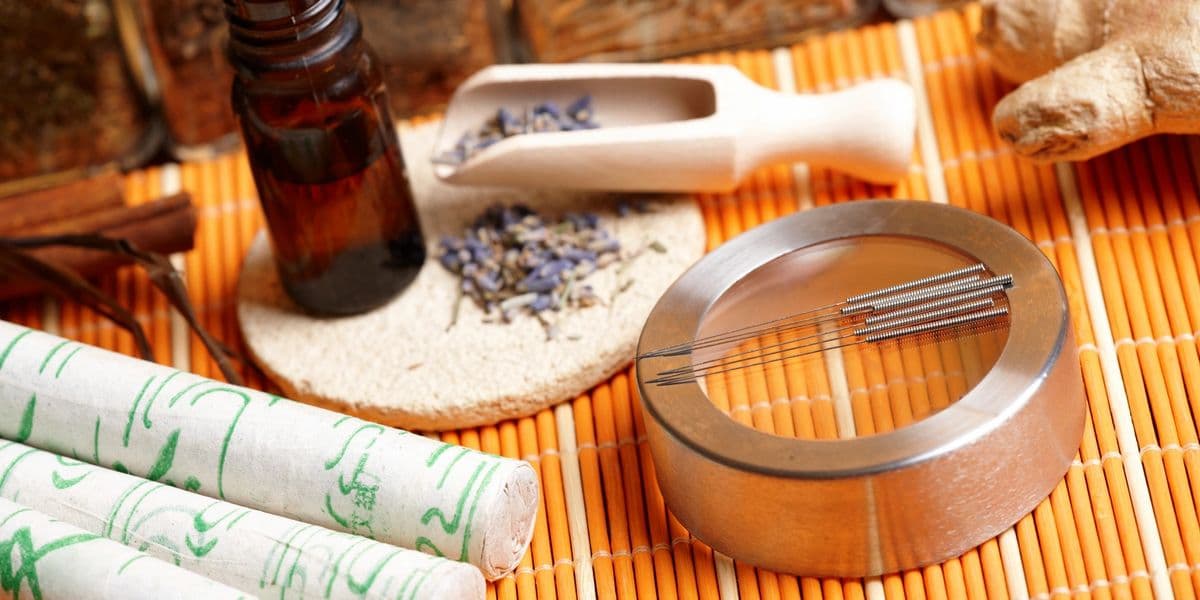 Herbal oils and a wooden bracelet for anti-aging treatment