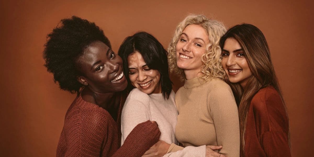 Group of women of different ages smiling together
